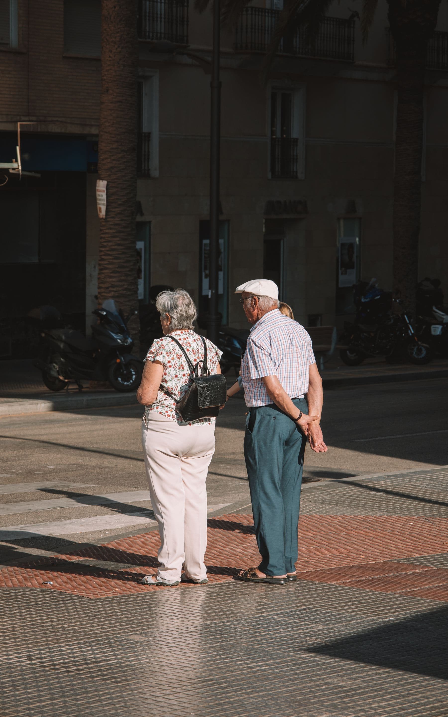 An older couple walking together in their community
